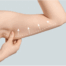 Person gently holding upper arm with arrows and dotted line indicating lifting and contouring areas for an arm lift (brachioplasty) procedure.